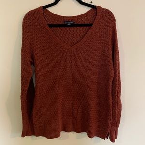 Maroon /rust coloured v neck American eagle loose knitted sweater.